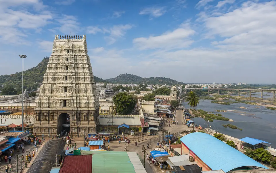 Wide view of Srikalahasteeswara Temple gopuram and the nearby Swarnamukhi riverfront in Srikalahasti town.