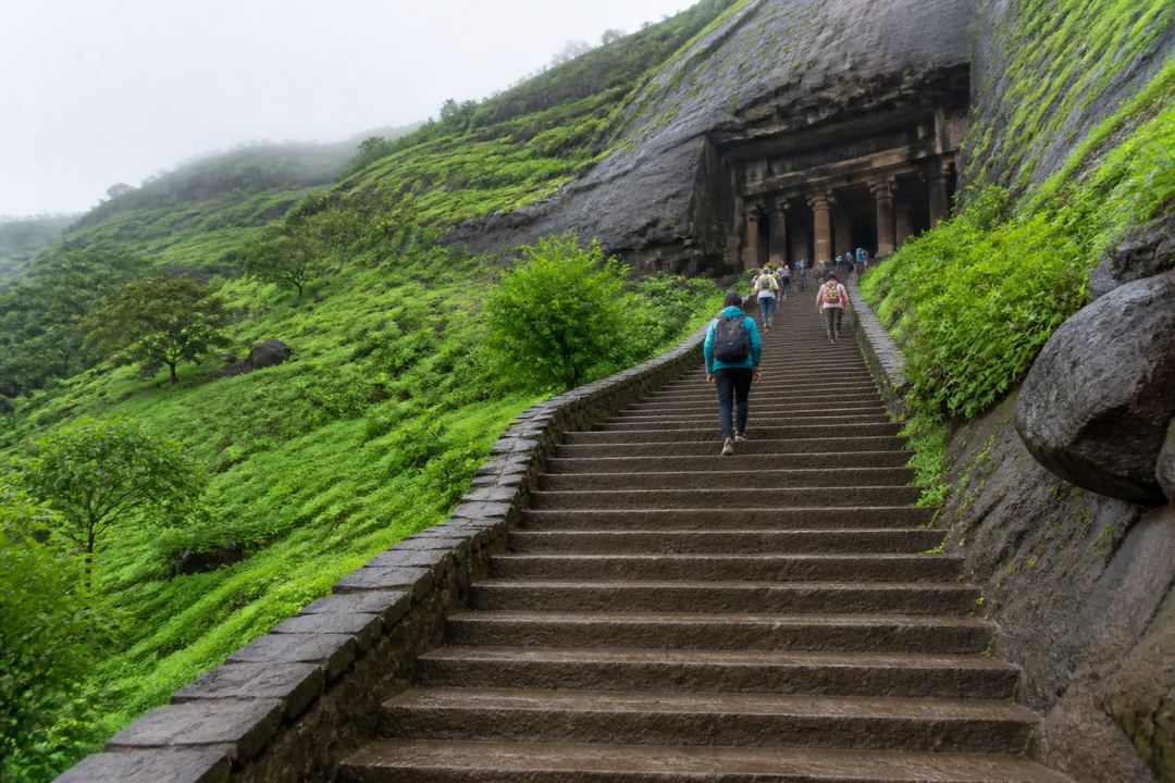 Stone steps leading up to rock-cut Buddhist caves on a hillside near Lonavala.