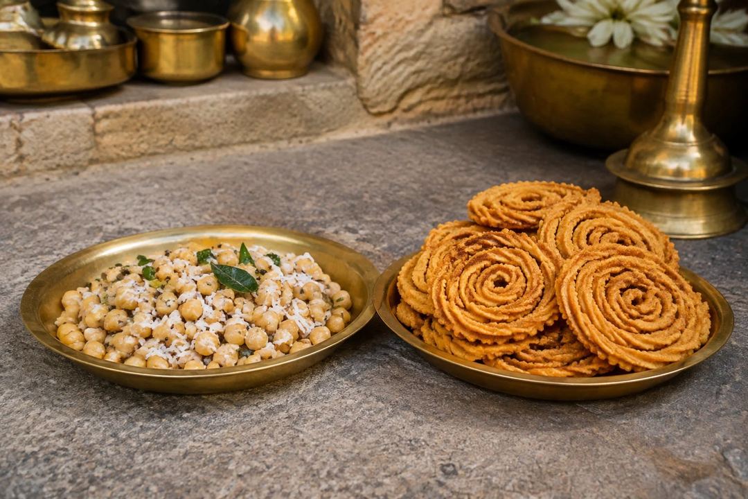 Chickpea sundal with coconut and crisp spiral murukku on separate brass plates
