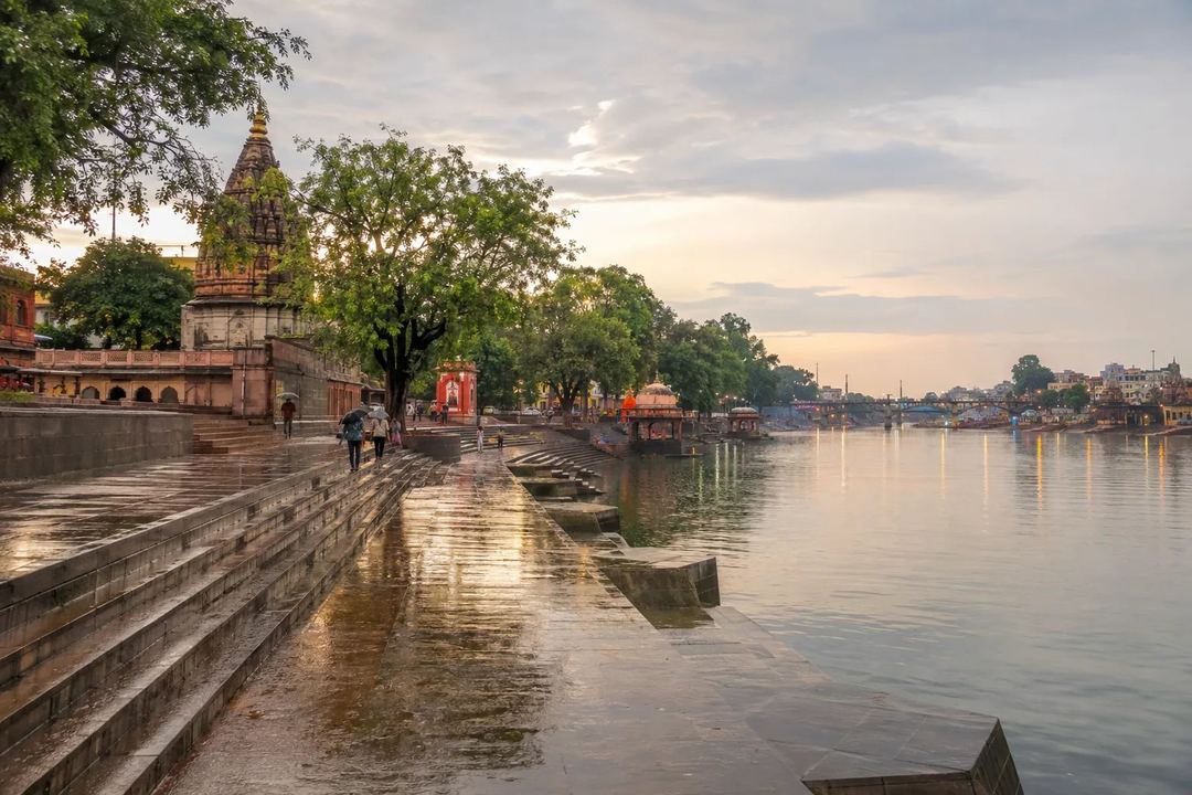 Ujjain river ghats after rain with wet stone steps and soft evening light