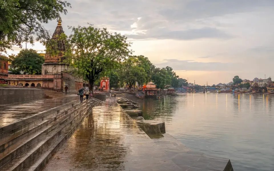 Ujjain river ghats after rain with wet stone steps and soft evening light