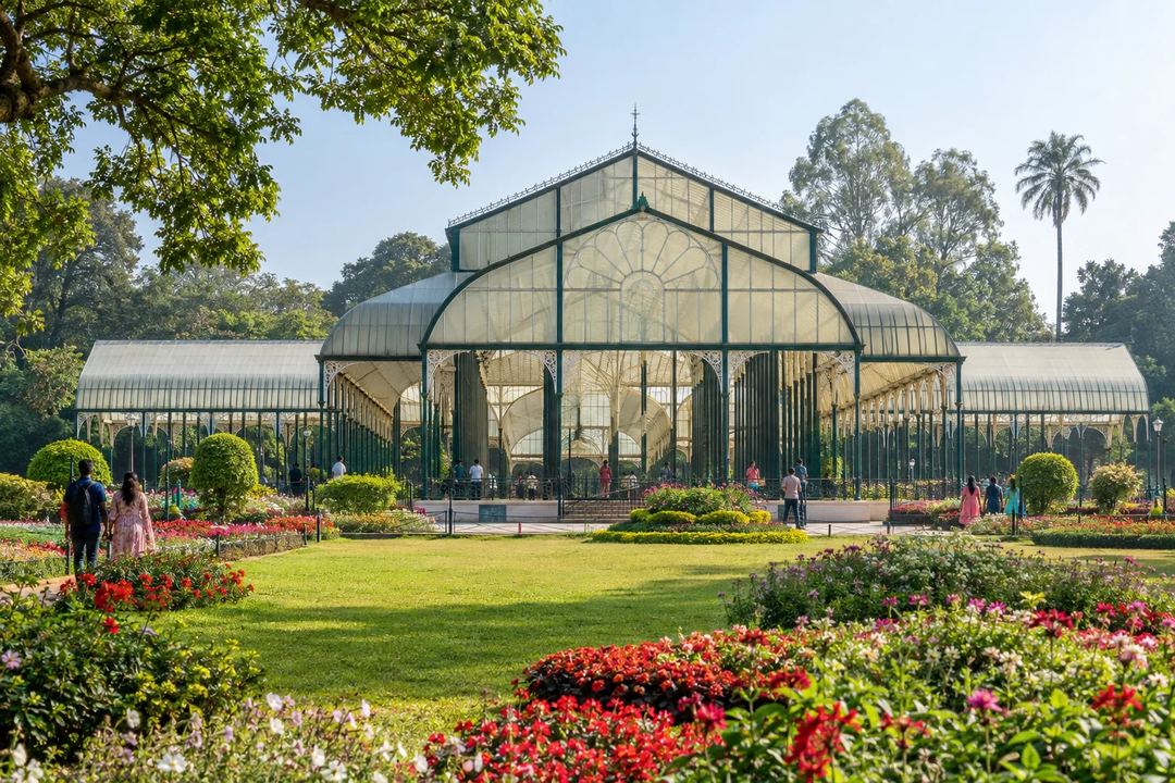 Illustration of the Lalbagh glasshouse surrounded by lawns and flower beds.