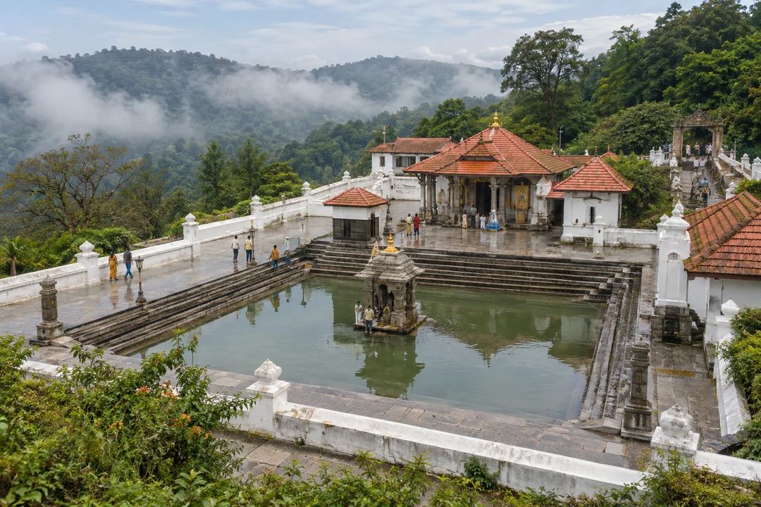 Illustration of the temple complex and water tank at Talakaveri with misty hills beyond.