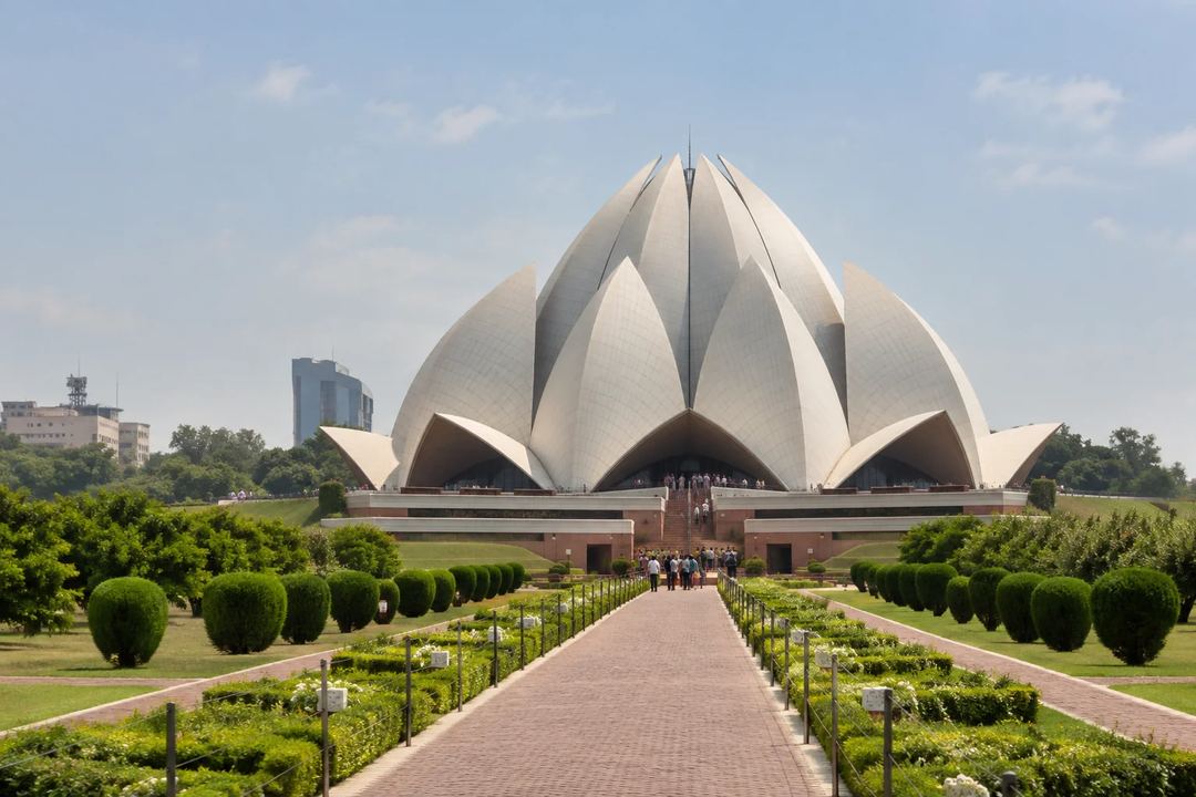 Illustration of the Lotus Temple with its petal-shaped roof and landscaped approach.