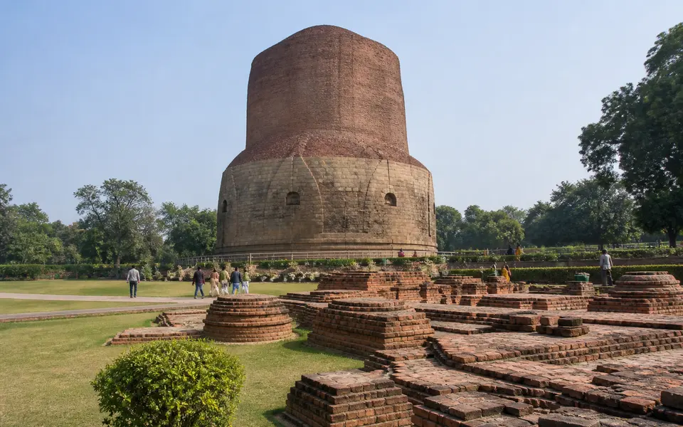 The Dhamek Stupa and surrounding lawns at Sarnath near Varanasi on a clear morning.