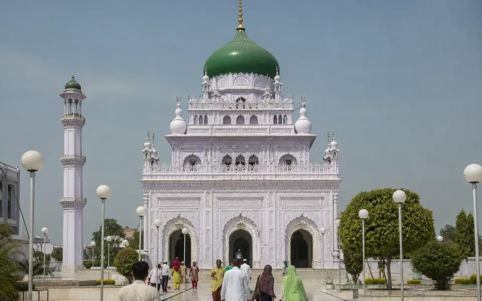 Illustrative view of the domed shrine and courtyard at Dewa Shareef.
