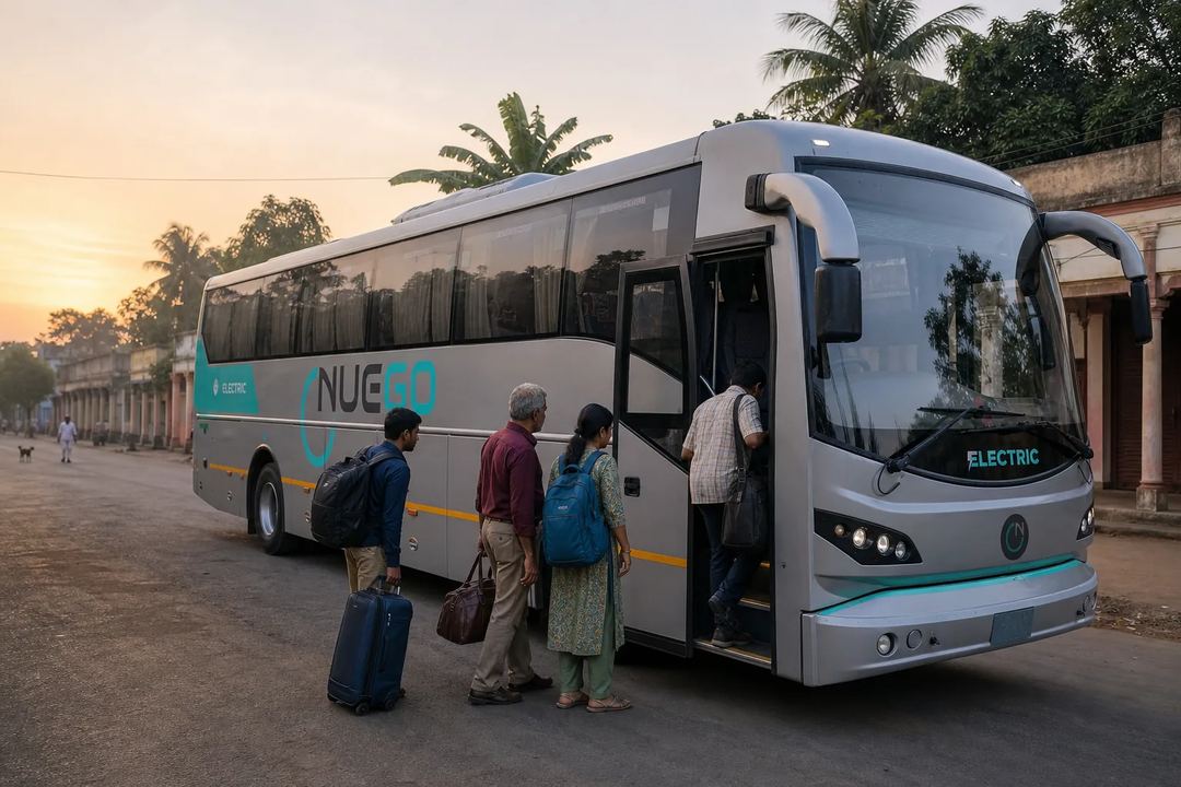 Travellers with small bags boarding a NueGo electric intercity coach at dawn.