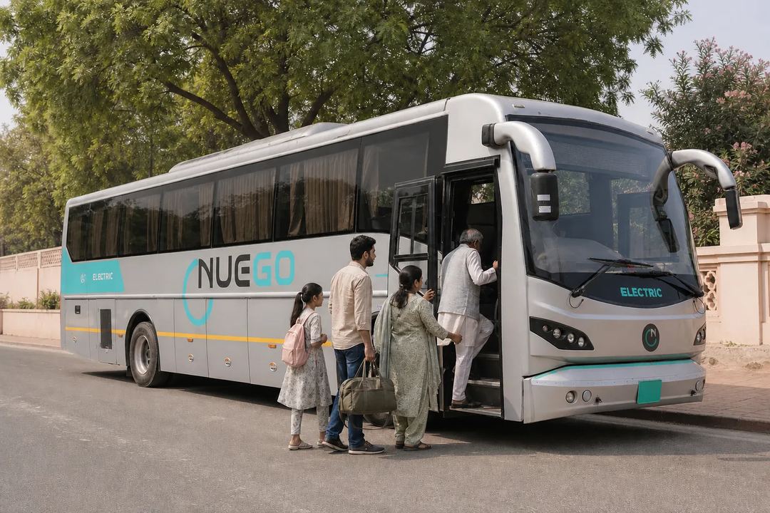 Family with luggage boarding a NueGo electric intercity coach for a Mathura–Vrindavan journey.