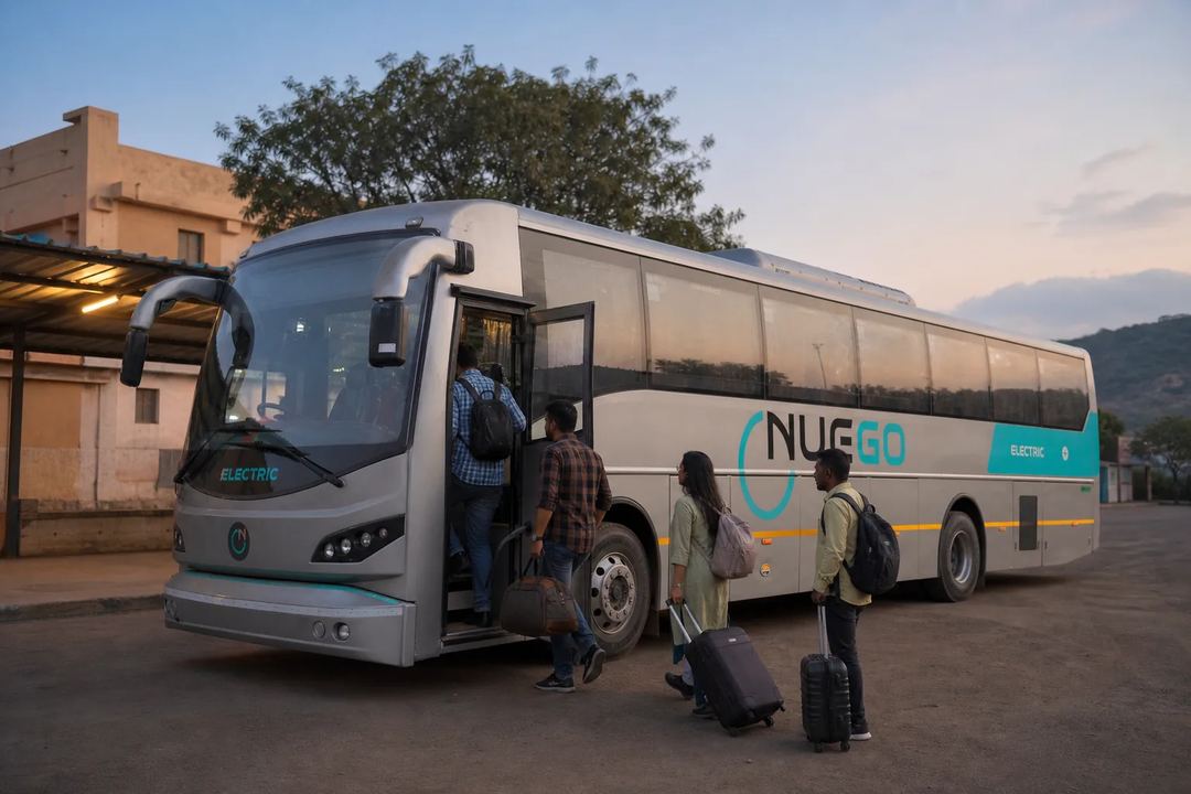 Passengers boarding a NueGo electric intercity coach for a served longer-distance corridor before connecting to Srikalahasti.