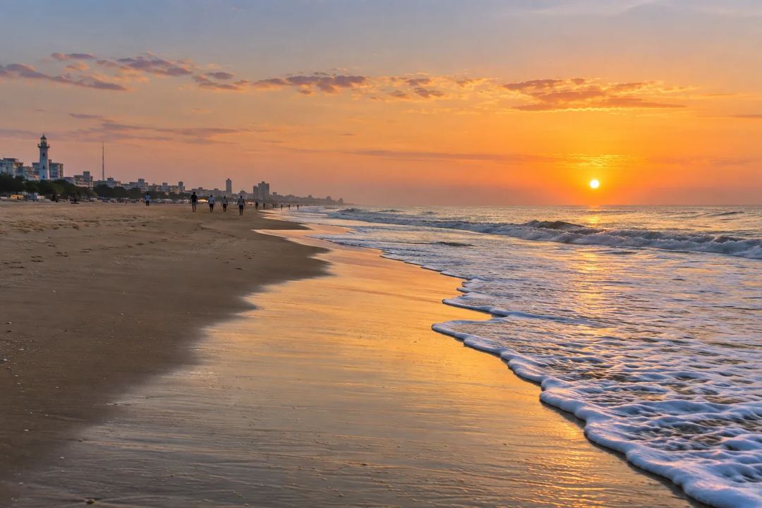 Illustration of people walking beside the sea at Marina Beach at sunset.