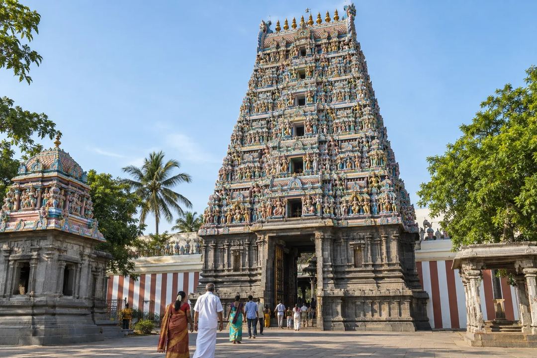Illustration of Kapaleeswarar Temple’s sculpted tower above visitors in Mylapore.