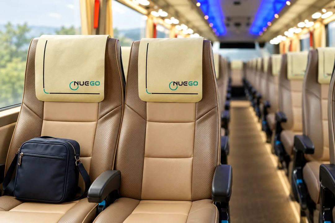 Illustration of reclining seats and the aisle inside a NueGo coach.